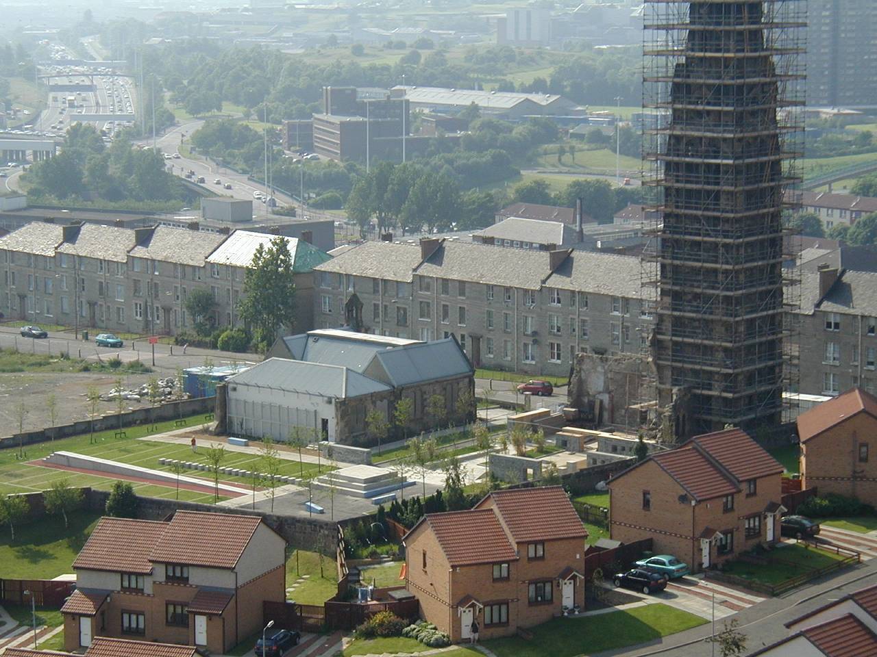 High level view over buildings, with a scaffolded old building