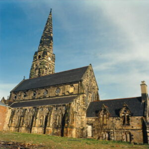 A large stone built church and steeple