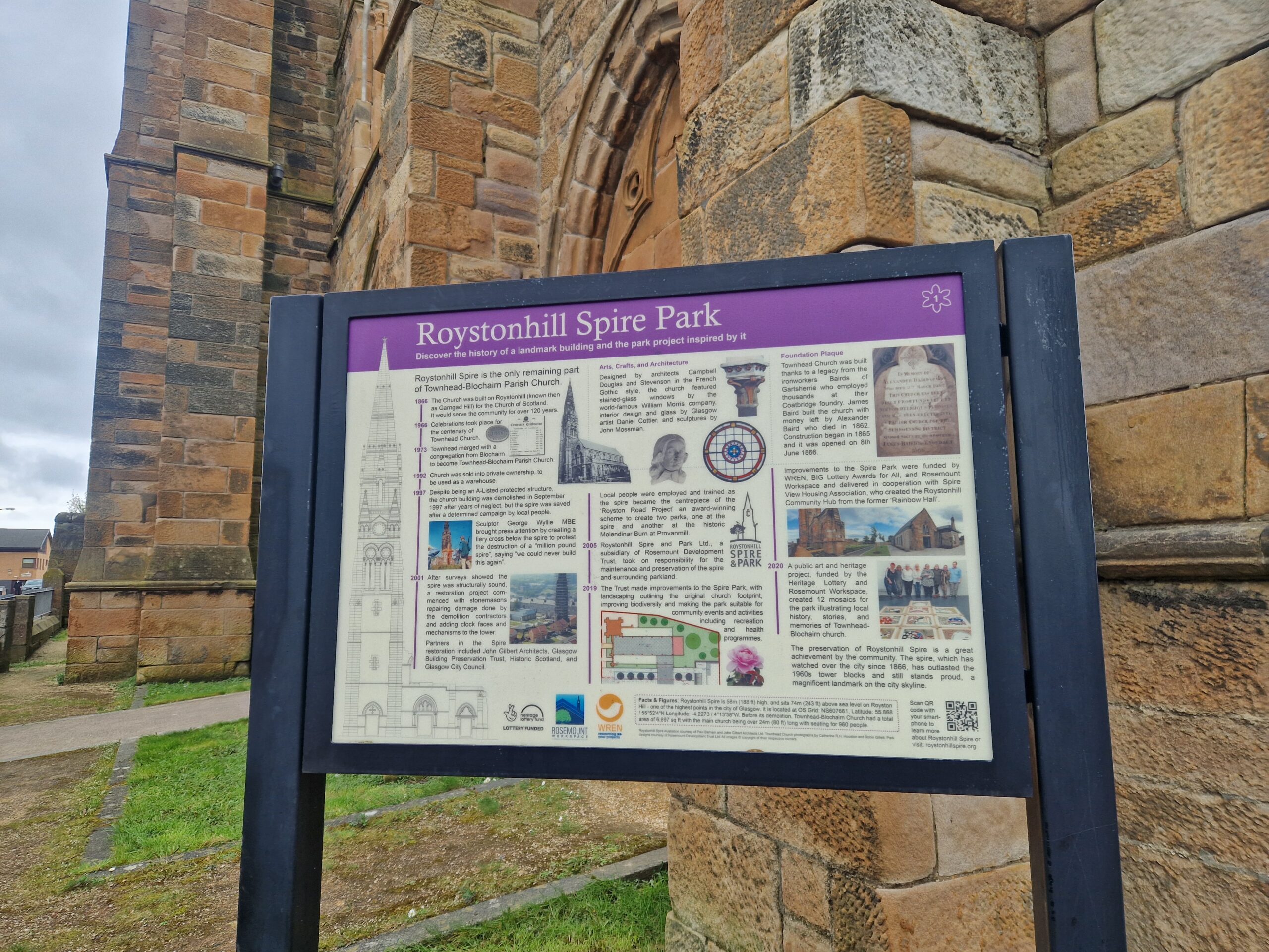 An information board with historical photos, drawings and text.